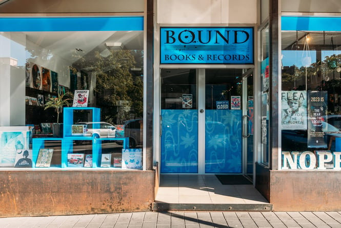 The blue entrance to Bound Books and Records in Queenstown.