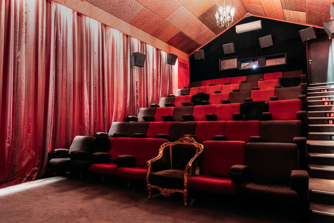 Red chairs in a cinema.