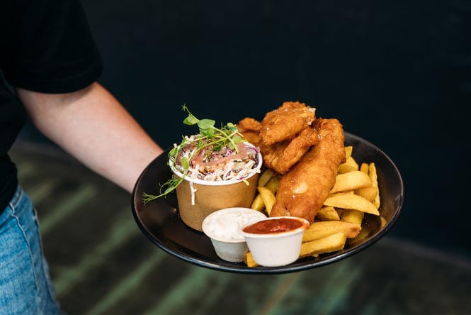 Fish and chips in a bowl.