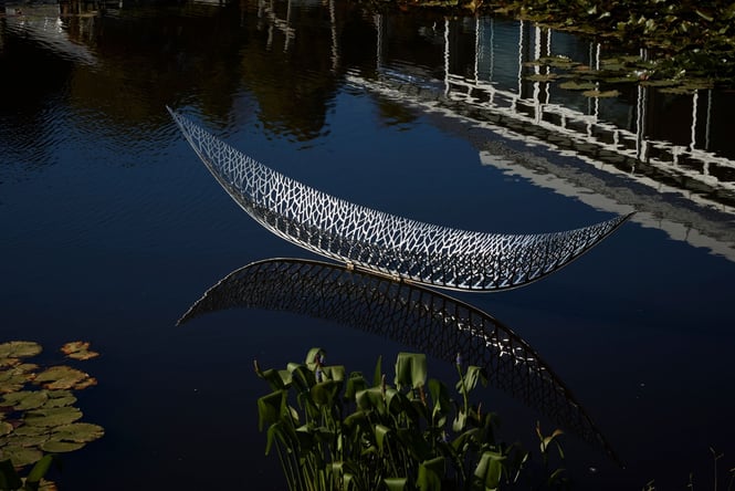 A sculpture boat on water.