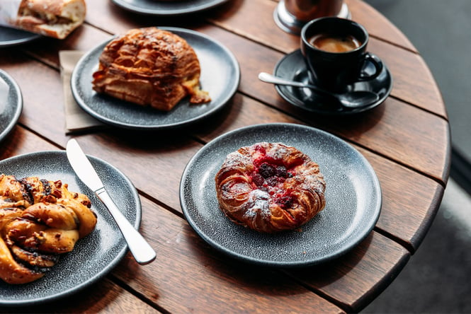 Pastries and coffee on a table.