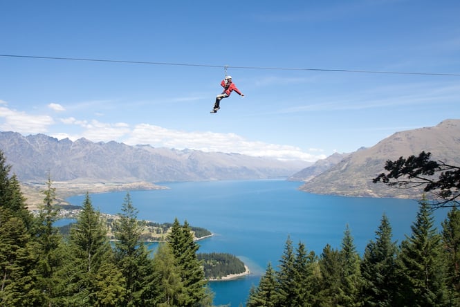 Someone on the EcoZip above a lake.