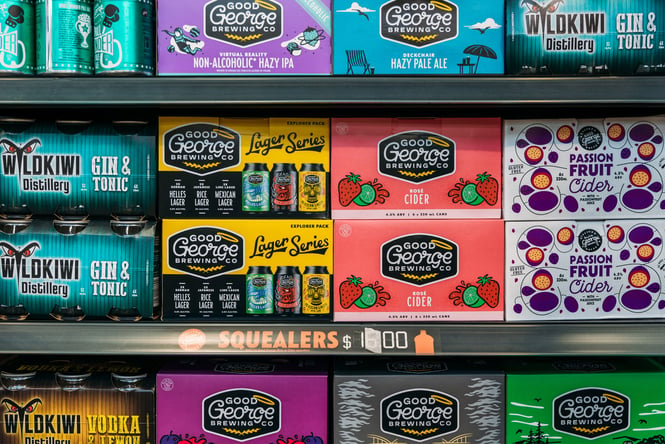 A close up of colourful beer boxes.