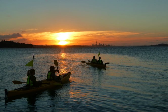 Kayaking at sunset.