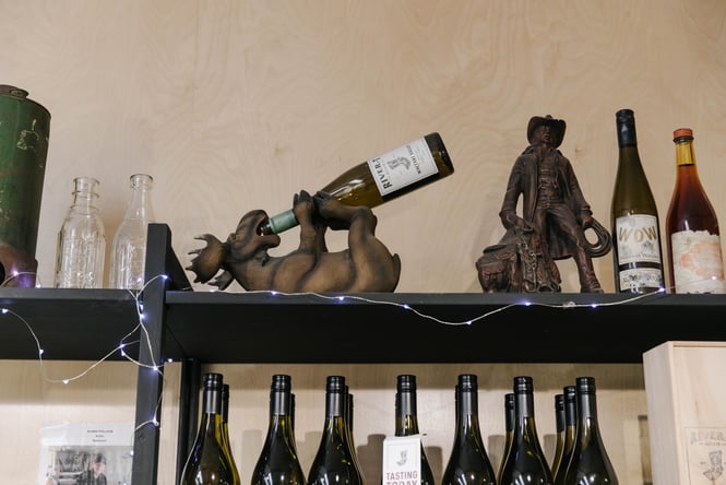 Close up of wine bottles on display.