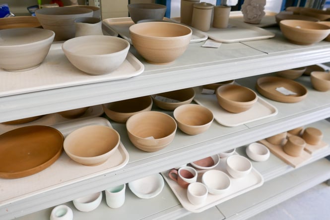 Pottery on display on shelves at The Clay Centre.