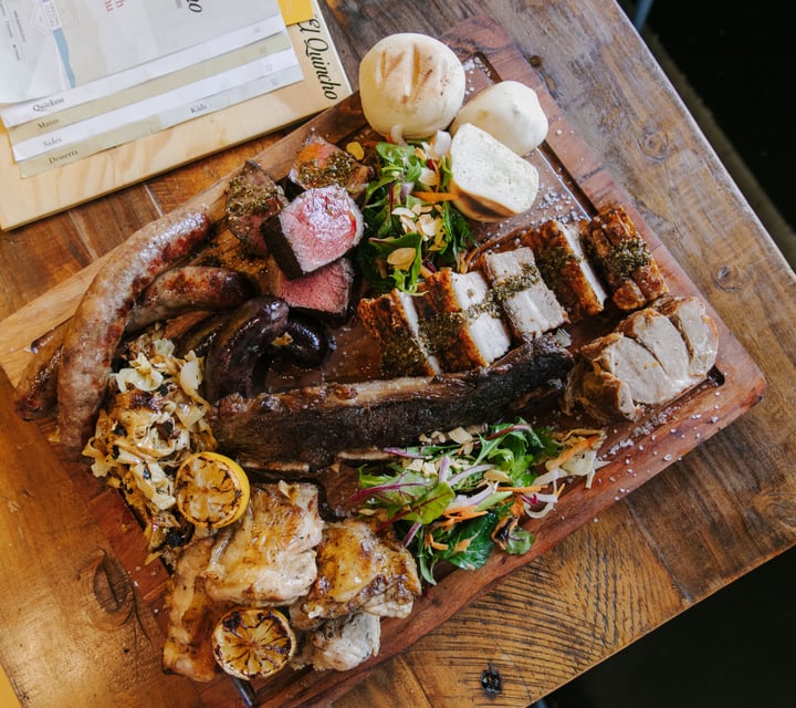 Flatlay of meat platter from El Quincho.