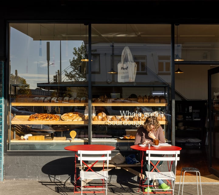 A customer dining outside Florets Bakery Auckland on a sunny day.