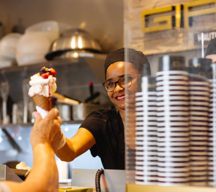 A woman serving a gelato.