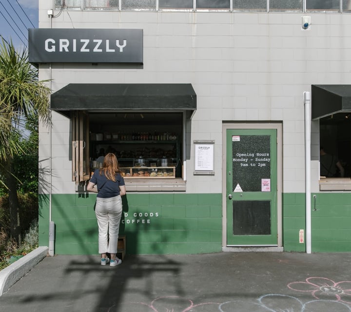A woman orders at the Grizzly Baked Goods window in Christchurch.