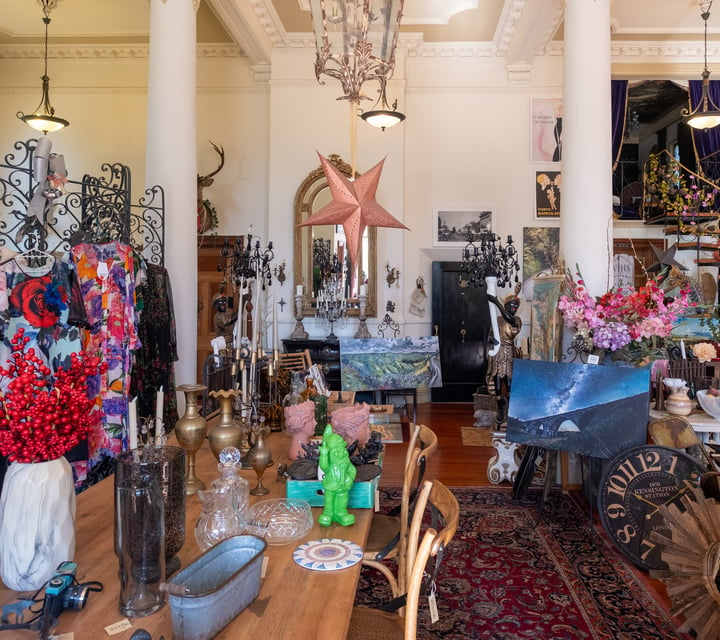 Ornate interior of secondhand and vintage shop with furniture and eclectic decor