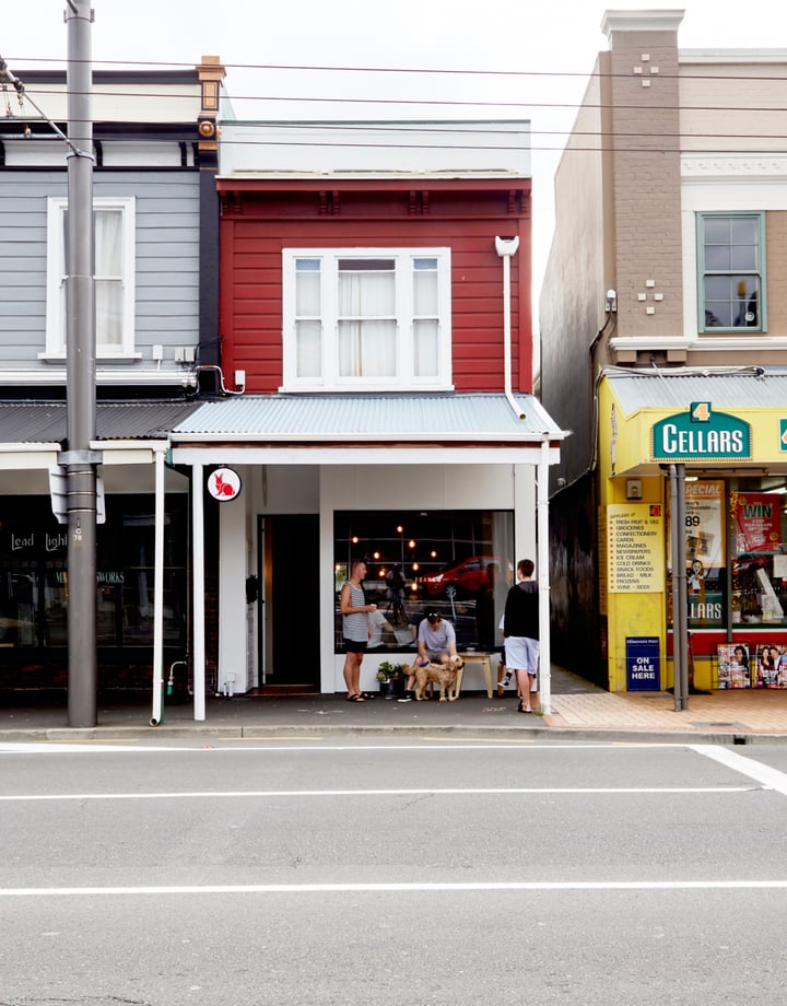 A view of shops from the other side of the street in Wellington's Newtown suburb.