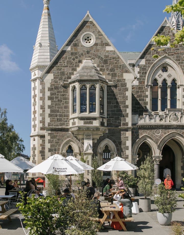 Exterior shot of the historic Arts Centre and Frances Nation Cafe in Christchurch on a hot summer's day