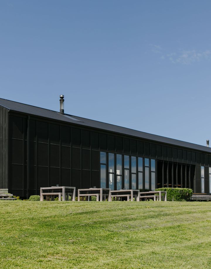 The exterior of the Black Estate building on a sunny day.