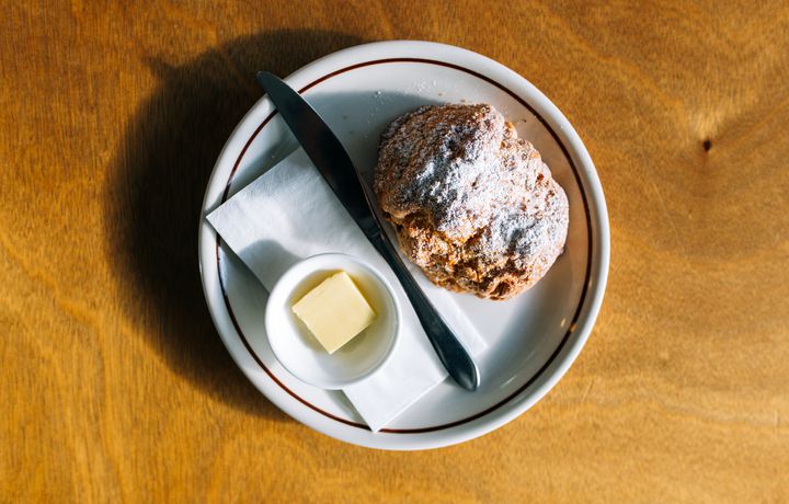 A scone on a table at Miltons Canteen cafe Hamilton.