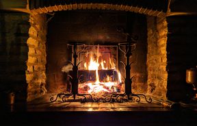 Roaring fire in fireplace by Stephane Juban.