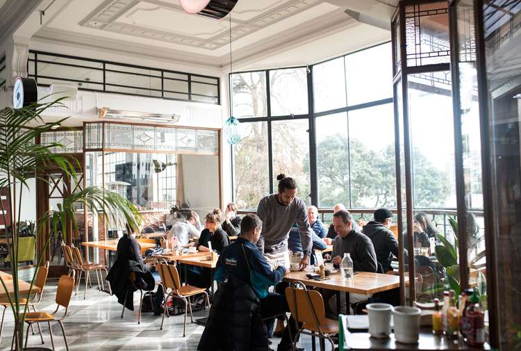 Guests dining inside Bestie Cafe in Auckland.