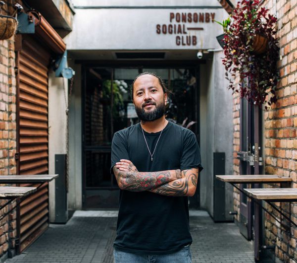 Bobby Brazuka standing in front of his business the Ponsonby Social Club in Auckland.