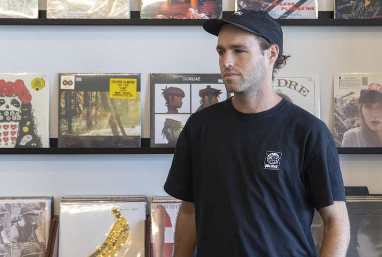Joel from Holiday Records inside his Auckland CBD store.