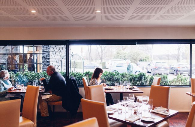 Big windows and comfortable seats create an elegant dining atmopshere at 50 Bistro in Christchurch.