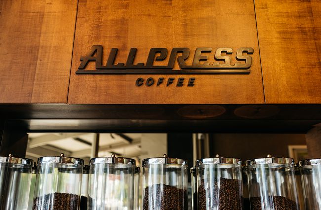 Allpress coffee sign on wood.