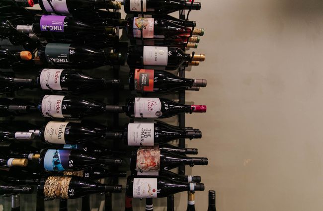 Bottles of wine on the rack at Porta Via.