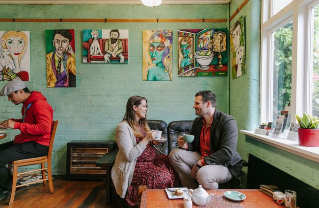 Couple sat at a table drinking coffee at Arthur St Kitchen, South Canterbury.