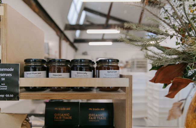A close up of quince jelly and jams inside small jars at Bellbird Bakery in Christchurch.