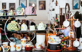 Teapots on shelves.