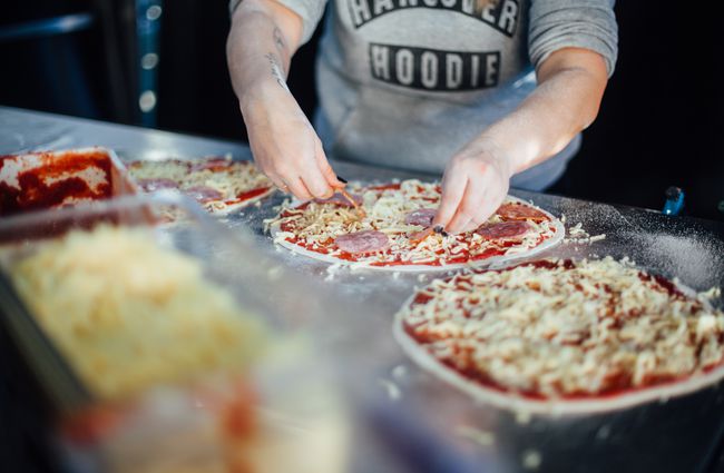 A pizza being made by the chef at Brew Moon Brewing Company.