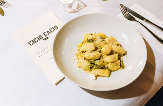 Gnocchi on white plate.