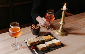 Drinks and cheese board on a table at Craftwork Brewery in Ōamaru.