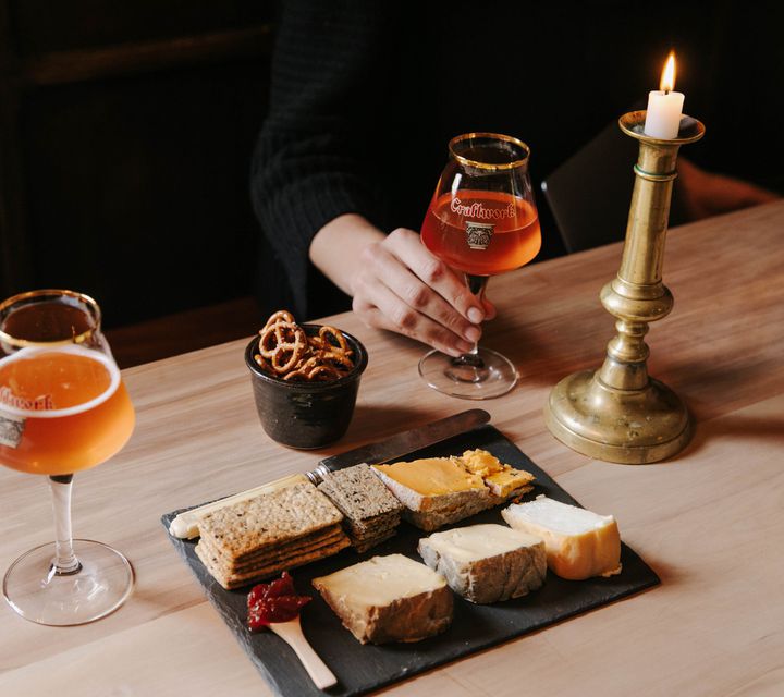 Drinks and cheese board on a table at Craftwork Brewery in Ōamaru.
