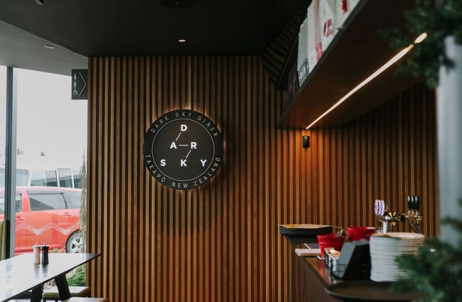 Dark Sky Diner logo on wood panelling in Tekapo.