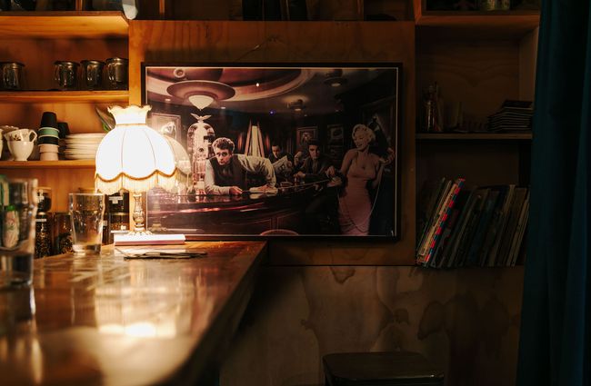 Retro lampshade on the bar with James Dean photo on the wall.