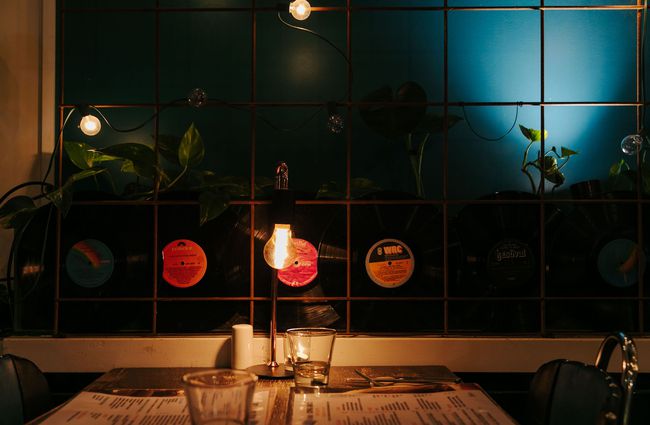 Table for two at East St Cafe with records on the wall.