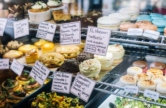 Cabinet filled with sweet treats and salads at Emmalou Macaron & Coffee, New Plymouth.