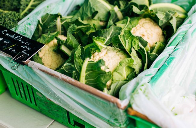 Close up of cauliflower in green bins.