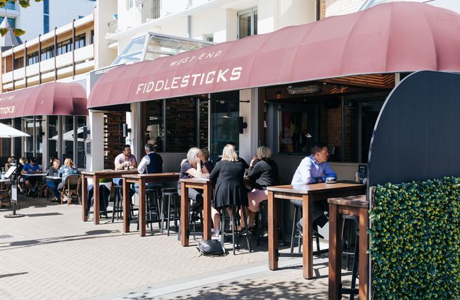People dining al fresco out front of Fiddlesticks.