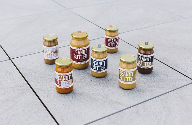 Jars of peanut butter on the ground outside Fix and Fogg Wellington.