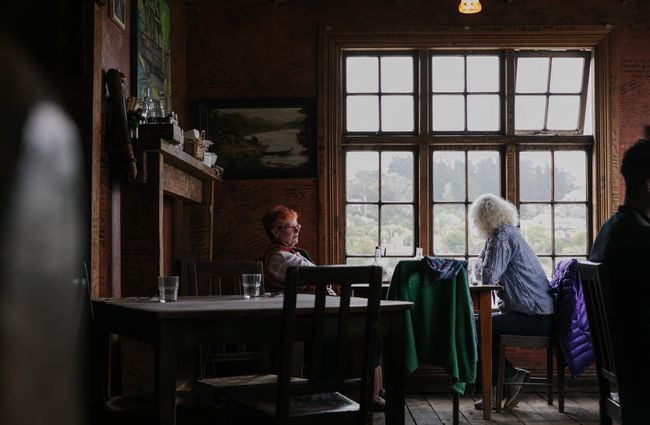 Two woman diners at a table at Fleurs Place in Moeraki.