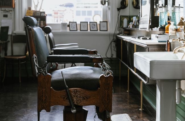 Two empty chairs at Frederick Woodward's Barber Shop in Christchurch.