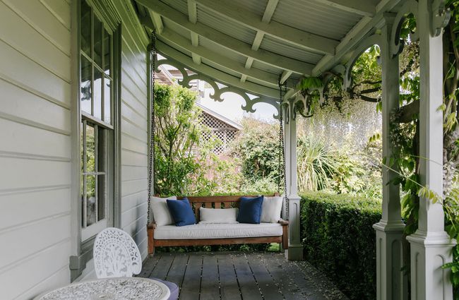 Swinging veranda seat at French Bay House, Akaroa Canterbury.