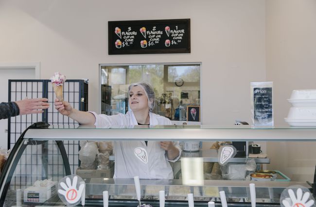Woman handing over a gelato cone at Gelato Lab in Christchurch. .