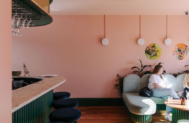 Pastel coloured walls and seating area at gin gin in Christchurch.