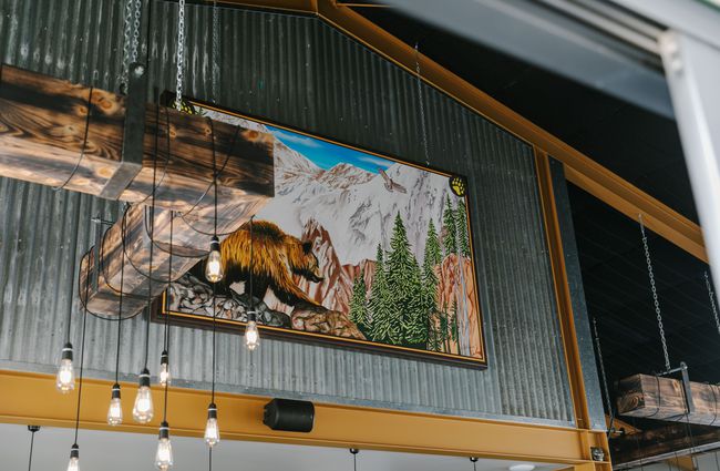 Painting of a golden beer on the wall at Golden Bear Brewing Company, Māpua Tasman.