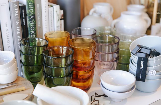 Stacked coloured glass tumblers at Harakeke Florist in Christchurch.