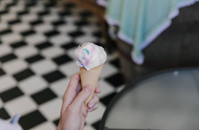 Close up of someone holding an ice cream at Deja Moo & Harbour Street Bakery in Ōamaru.
