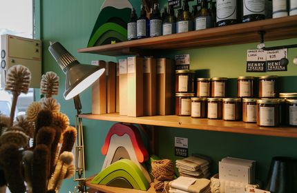 Anglepoise lamp with candles stocked on the shelves at Henry Trading, Lyttelton.
