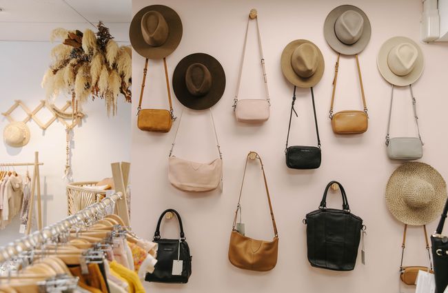 Wall display of hats and bags.
